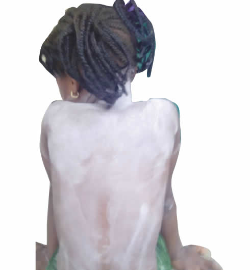 •A child covered with dusting powder. Photos: Eric Dumo, Esther Olajide and file