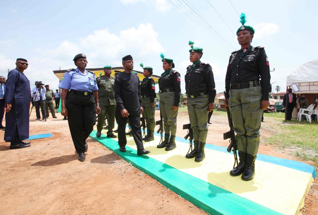 Ondo State Commissioner of Police Mrs. Hilda Ibifuro-Harrison leads the Vice President, Prof. Yemi Osinbajo SAN as he inspects a guard of honour mounted by The Nigeria Police Force at the New Police Divisional Headquarters Ilara-Mokin. Friday July 8, 2016 