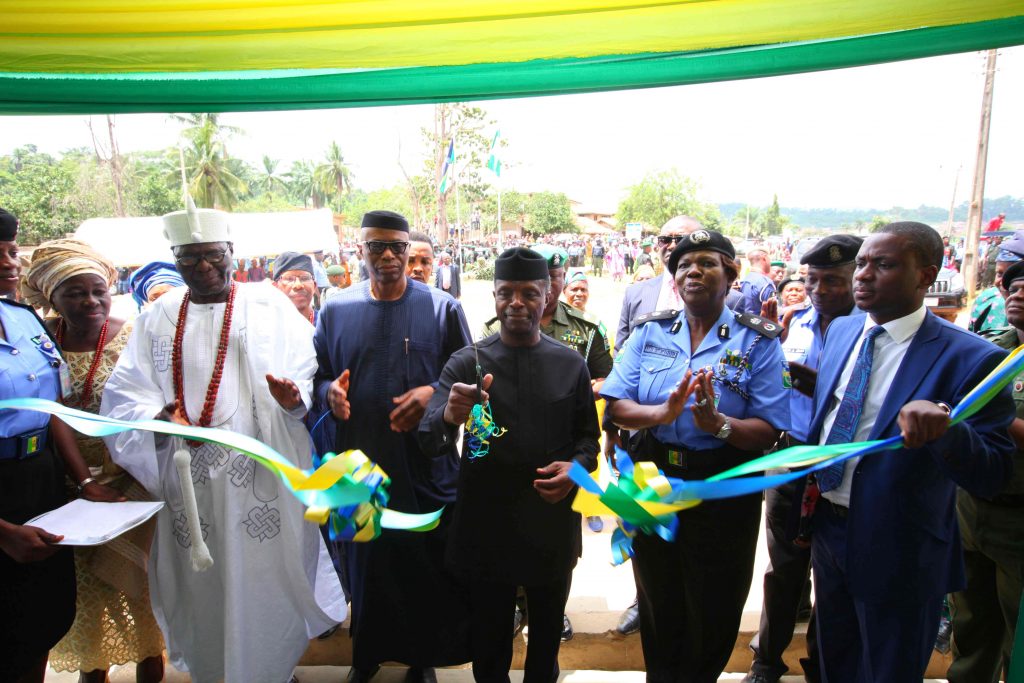 Vice President Prof. Yemi Osinbajo SAN cutting the tape at the commissioning of the New Divisional Headquarters of The Nigeria Police Force at Ilara-Mokin. on the VP’s right is His Excellency, Governor of Ondo State, Dr. Olusegun Mimiko and The Alara of Ilara-Mokin, Oba Aderemi Adefehinti and on his left is Ondo State Commissioner of Police Mrs. Hilda Ibifuro-Harrison 