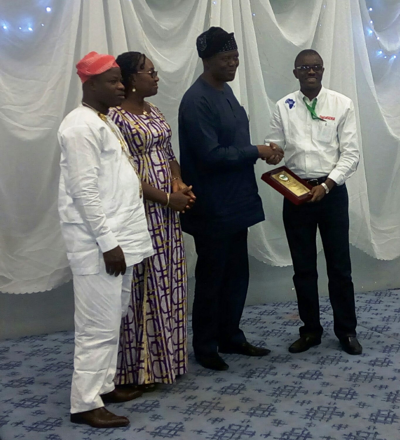 NCS presidential award 2016 - former NCS president+Executive chairman Chams Plc Sir Demola Aladekomo congratulates RN while NCS President Prof Sola Aderounmu and chairperson Ethics Committee Dr Mrs Titilola Akinlade